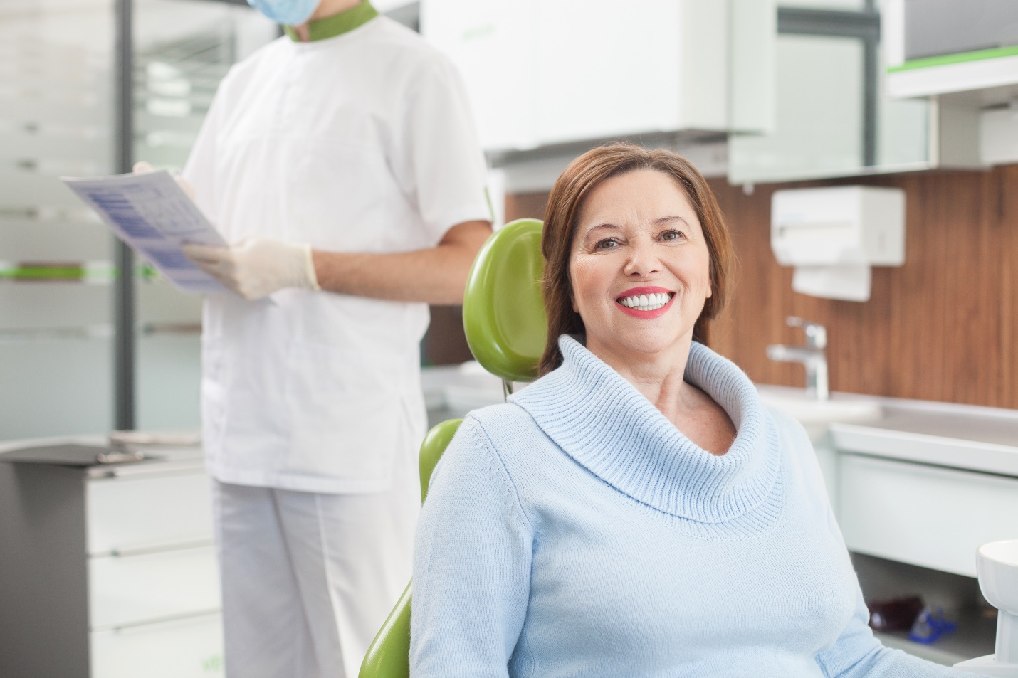 Woman smiling with dental bridge in West Edmonton