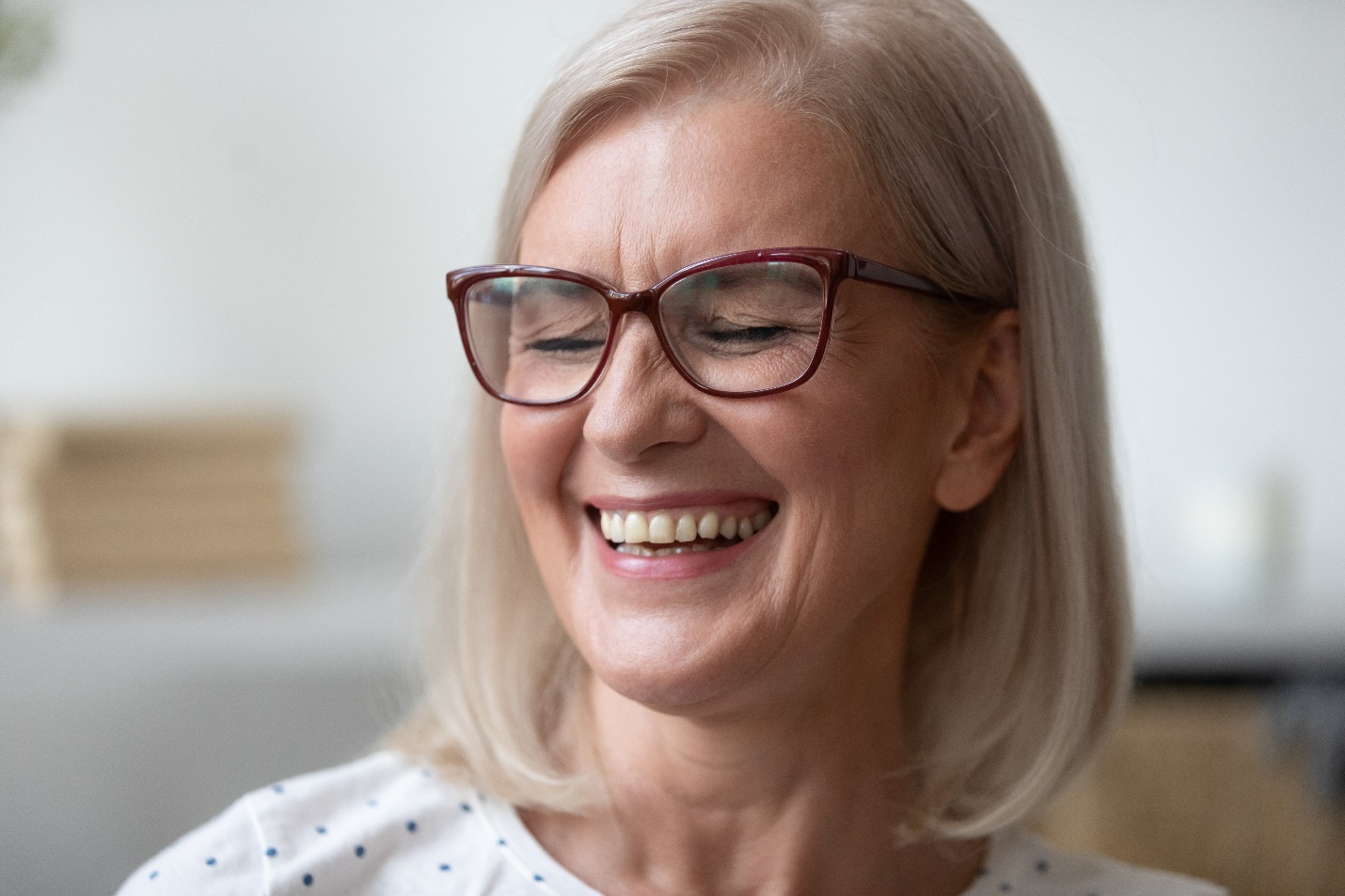 Woman smiling with dental crown in West Edmonton