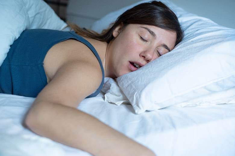 Woman with sleep apnea in West Edmonton, AB sleeping on her stomach