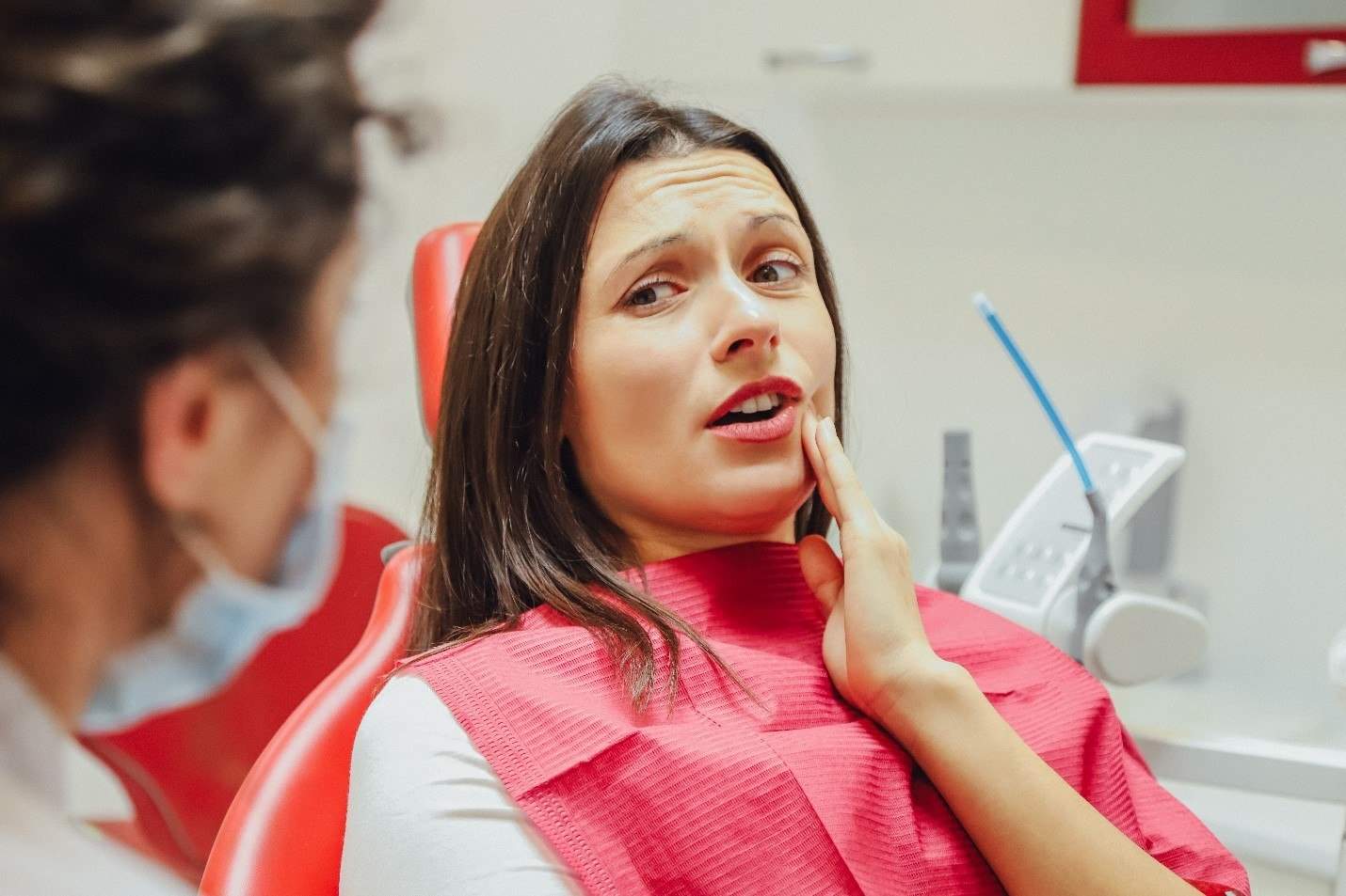 Woman at dentist needing root canal therapy in Edmonton