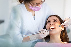 woman undergoing checkup for dental implant care in Edmonton