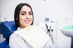 patient smiling about cost of root canal in West Edmonton