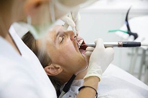 Closeup of man relaxing while getting the dental care he needs 