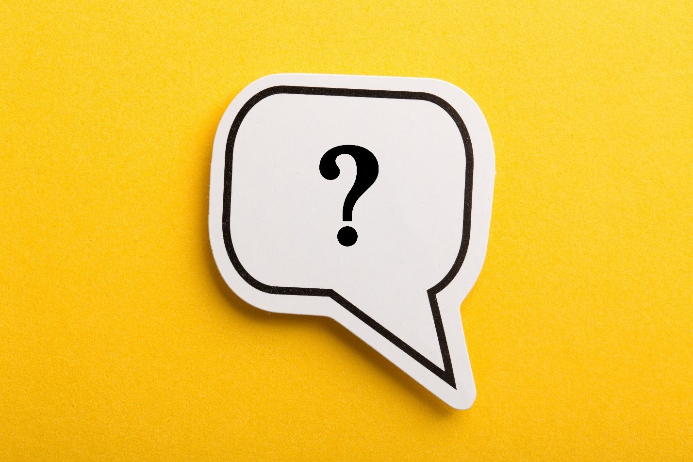 Speech bubble with question mark on a bright yellow background